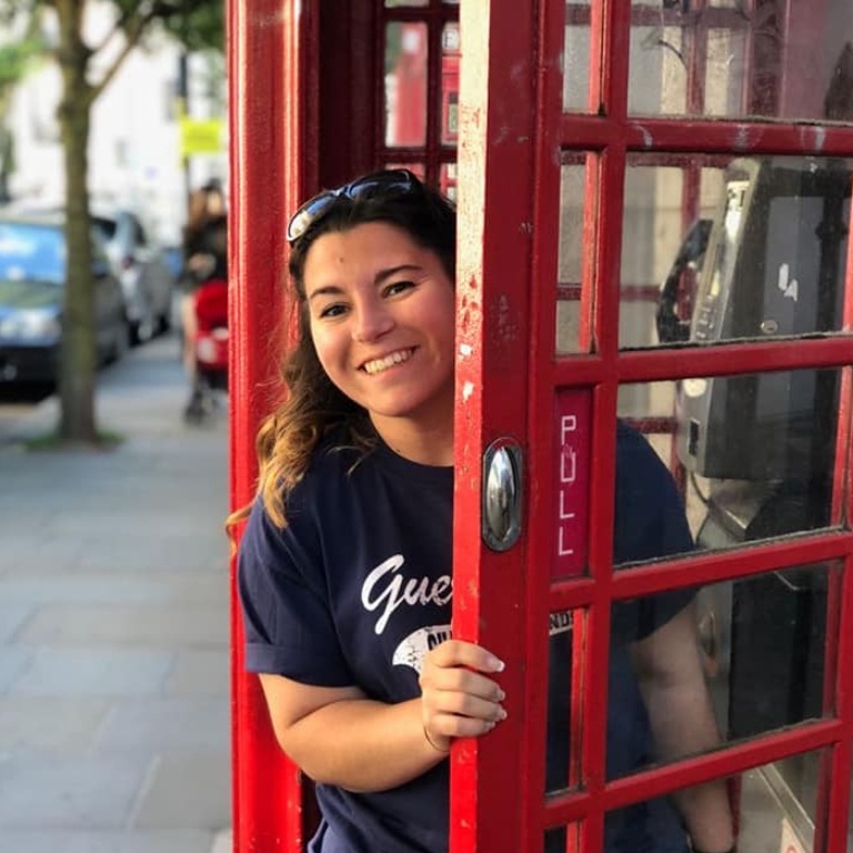 A student in a red phone booth.