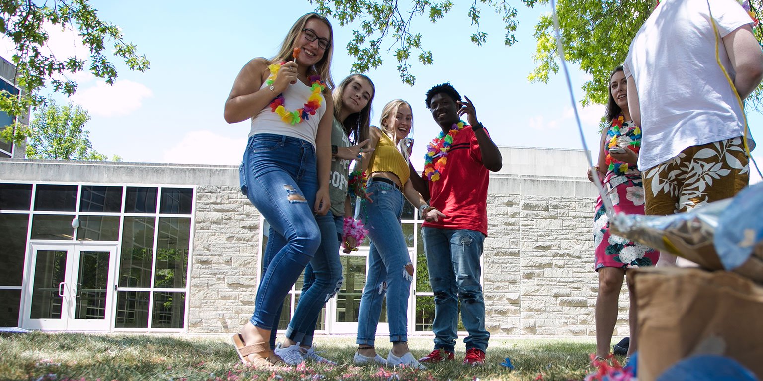 four students standing together.
