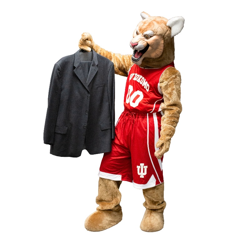 IUK Mascot Kingston holding a jacket.