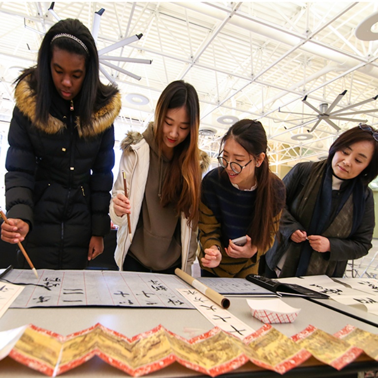 International student and faculty participating in activities.