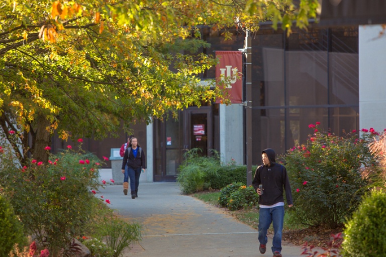 students walking on campus in the fall